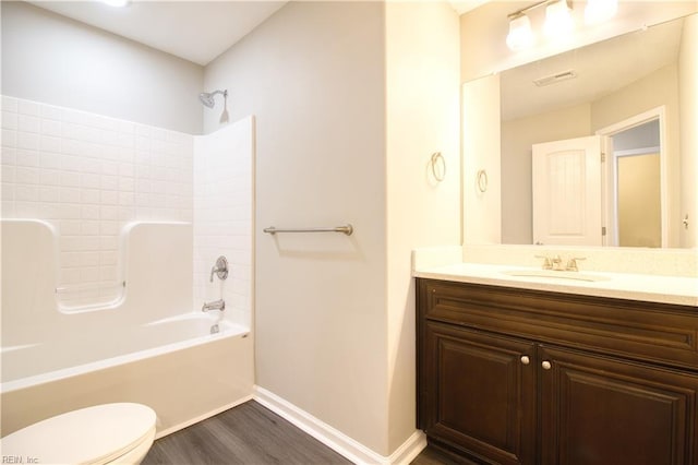 1808 Princeton Ave, Norfolk, VA 23523 - bathroom with toilet, vanity, wood finished floors, washtub / shower combination, and baseboards