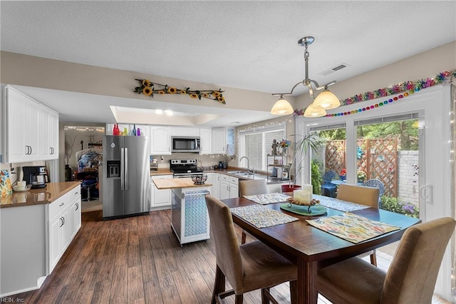 6372 Colby Way, Virginia Beach, VA 23464 - kitchen with appliances with stainless steel finishes, a sink, dark wood finished floors, white cabinets, and a textured ceiling