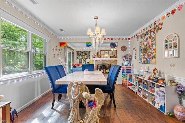 6372 Colby Way, Virginia Beach, VA 23464 - dining space featuring a chandelier, ornamental molding, hardwood / wood-style flooring, and a fireplace