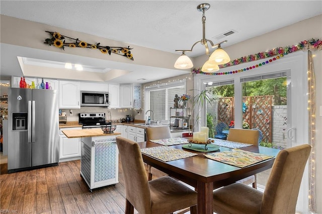6372 Colby Way, Virginia Beach, VA 23464 - dining space featuring a chandelier, a raised ceiling, and dark wood finished floors