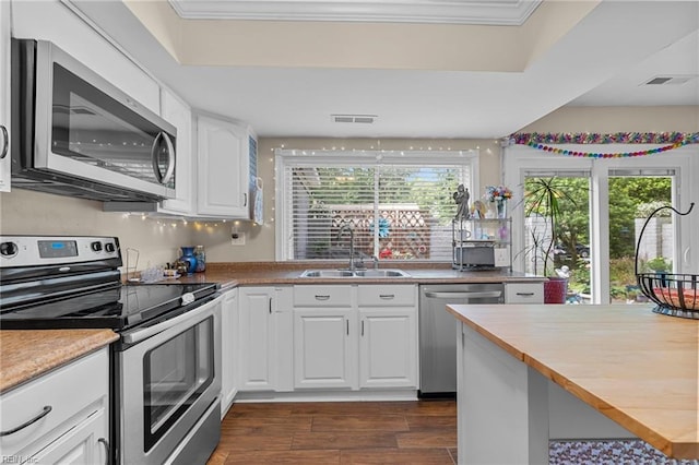6372 Colby Way, Virginia Beach, VA 23464 - kitchen featuring stainless steel appliances, a sink, dark wood-style floors, white cabinetry, and wooden counters