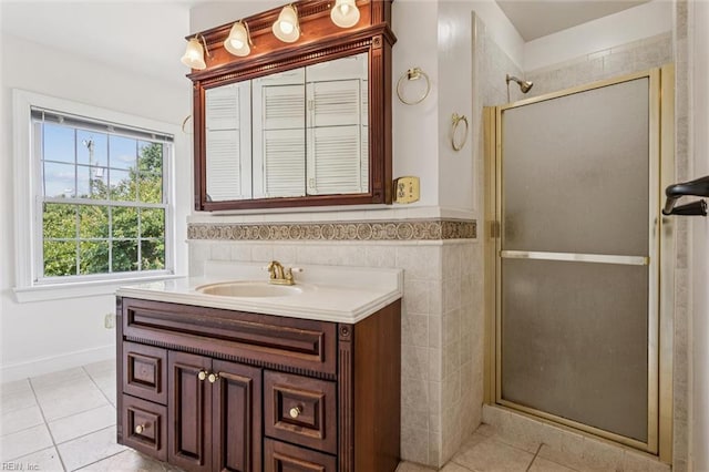 4002 Chesapeake Ave, Hampton, VA 23669 - bathroom featuring a shower stall, vanity, tile patterned flooring, wainscoting, and tile walls