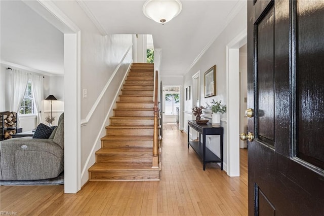 4002 Chesapeake Ave, Hampton, VA 23669 - stairs with wood-type flooring and crown molding