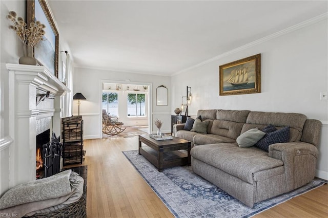 4002 Chesapeake Ave, Hampton, VA 23669 - living room with wood finished floors, a lit fireplace, and ornamental molding