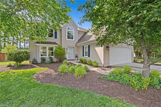 2753 Elson Green Ave, Virginia Beach, VA 23456 - traditional-style home with stucco siding, driveway, an attached garage, roof with shingles, and a front lawn