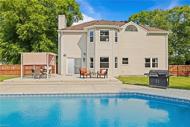 2753 Elson Green Ave, Virginia Beach, VA 23456 - rear view of house with a fenced backyard, a chimney, a patio, and outdoor dining area