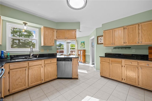 2753 Elson Green Ave, Virginia Beach, VA 23456 - kitchen featuring stainless steel dishwasher, dark countertops, a sink, light tile patterned floors, and stove