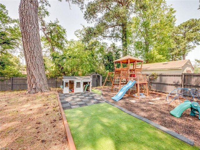 1803 Revere Dr, Hampton, VA 23664 - fenced backyard featuring a playground