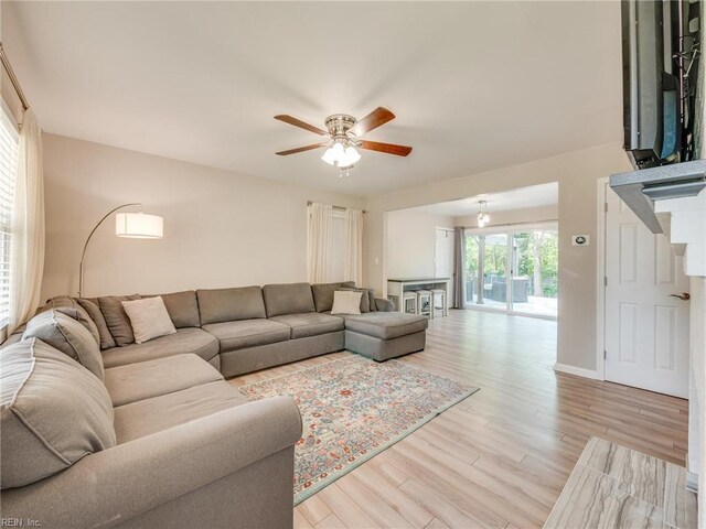 1803 Revere Dr, Hampton, VA 23664 - living room featuring a ceiling fan and light wood-style floors