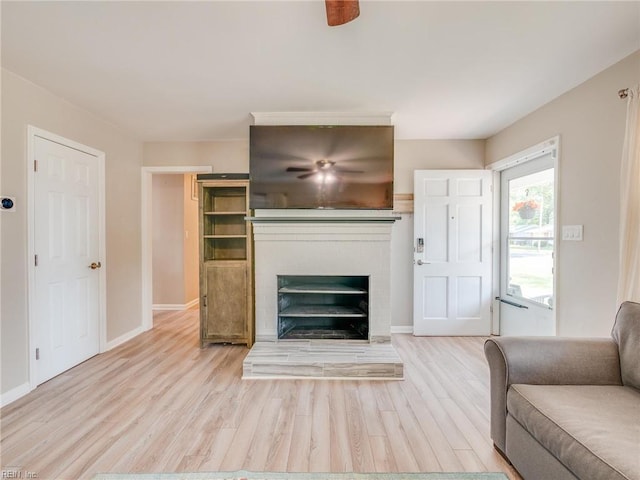 1803 Revere Dr, Hampton, VA 23664 - living room featuring wood finished floors, a brick fireplace, and baseboards