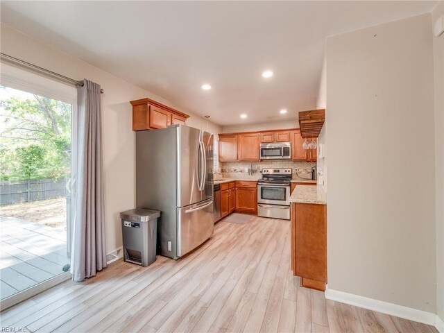 1803 Revere Dr, Hampton, VA 23664 - kitchen featuring appliances with stainless steel finishes, light wood-style flooring, backsplash, baseboards, and recessed lighting
