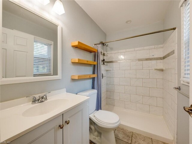 1803 Revere Dr, Hampton, VA 23664 - full bath featuring vanity, toilet, a tile shower, and tile patterned floors