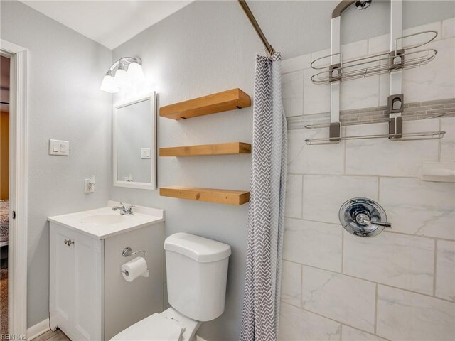 1803 Revere Dr, Hampton, VA 23664 - full bathroom with tiled shower, vanity, and toilet