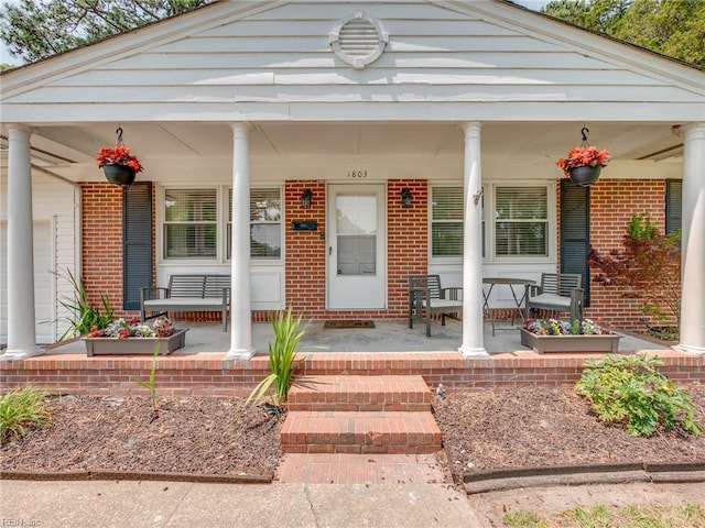 1803 Revere Dr, Hampton, VA 23664 - entrance to property with covered porch and brick siding