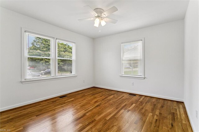 4 Greenwood Dr, Hampton, VA 23666 - empty room featuring wood finished floors, baseboards, and a ceiling fan