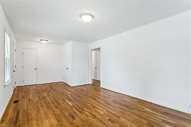 4 Greenwood Dr, Hampton, VA 23666 - spare room featuring wood finished floors, baseboards, and plenty of natural light