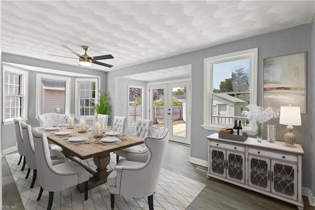 1020 Philpotts Rd, Norfolk, VA 23513 - dining room featuring baseboards, a ceiling fan, french doors, wood finished floors, and a textured ceiling