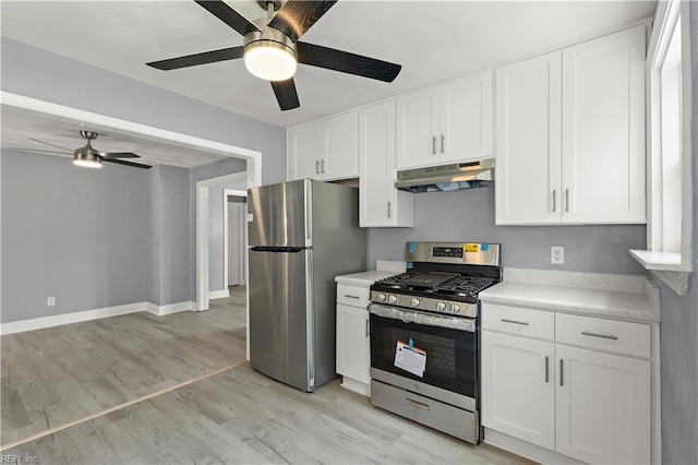 1020 Philpotts Rd, Norfolk, VA 23513 - kitchen featuring appliances with stainless steel finishes, under cabinet range hood, a ceiling fan, light countertops, and light wood-type flooring