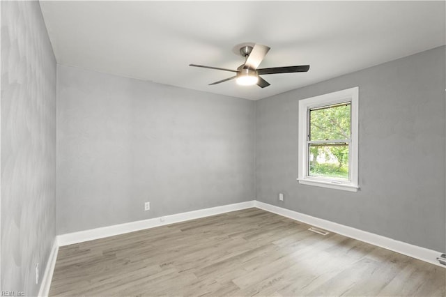 1020 Philpotts Rd, Norfolk, VA 23513 - unfurnished room featuring wood finished floors, ceiling fan, and baseboards