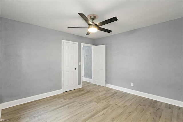 1020 Philpotts Rd, Norfolk, VA 23513 - unfurnished bedroom with wood finished floors, baseboards, and ceiling fan