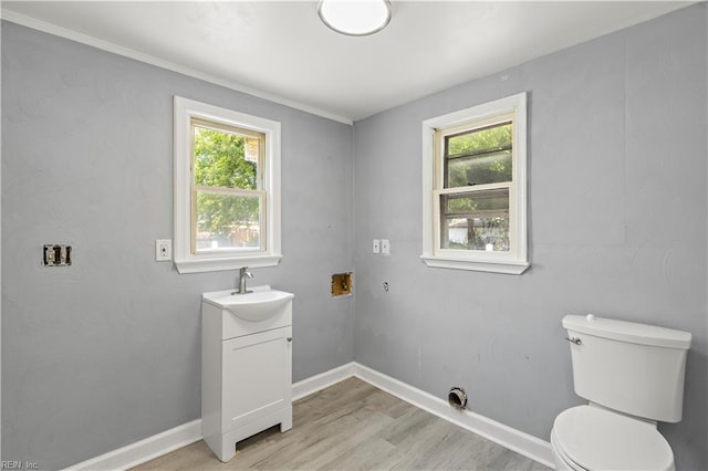 1020 Philpotts Rd, Norfolk, VA 23513 - bathroom with toilet, vanity, wood finished floors, and baseboards