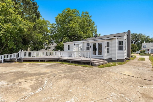 1020 Philpotts Rd, Norfolk, VA 23513 - view of front of house with french doors and a deck