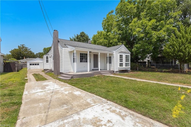 1020 Philpotts Rd, Norfolk, VA 23513 - view of front of home featuring concrete driveway, covered porch, a chimney, and a garage