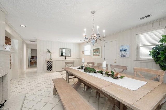7006 Atlantic Ave, Virginia Beach, VA 23451 - dining space with a chandelier, light tile patterned floors, and a fireplace