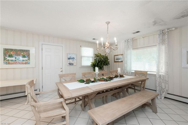 7006 Atlantic Ave, Virginia Beach, VA 23451 - dining space featuring a chandelier, baseboard heating, and light tile patterned floors