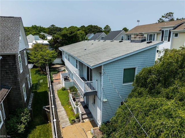 7006 Atlantic Ave, Virginia Beach, VA 23451 - rear view of property featuring roof with shingles and a residential view