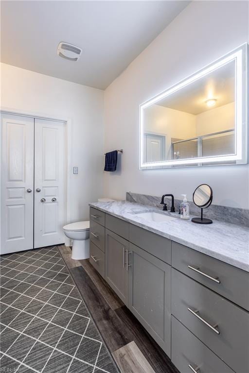 1400 Granby St Unit 413, Norfolk, VA 23510 - bathroom featuring vanity, wood finished floors, and toilet