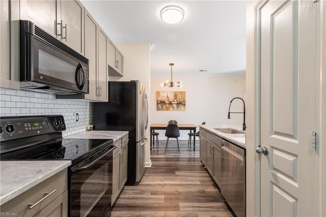 1400 Granby St Unit 413, Norfolk, VA 23510 - kitchen with black appliances, a sink, tasteful backsplash, gray cabinets, and ornamental molding