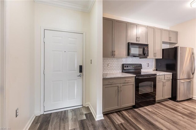 1400 Granby St Unit 413, Norfolk, VA 23510 - kitchen with black appliances, gray cabinets, dark wood-style floors, ornamental molding, and tasteful backsplash