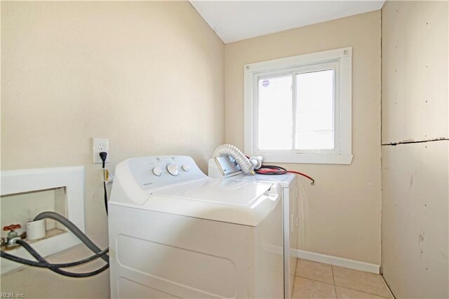 3124 Choctaw Dr, Virginia Beach, VA 23464 - laundry area with light tile patterned floors, washer and clothes dryer, and baseboards