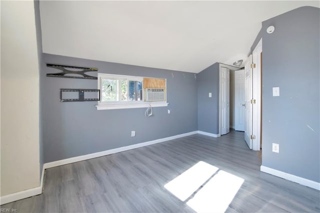3124 Choctaw Dr, Virginia Beach, VA 23464 - unfurnished room with wood finished floors, vaulted ceiling, baseboards, a smoke detector, and cooling unit