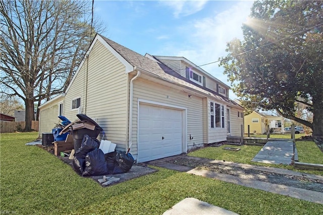 3124 Choctaw Dr, Virginia Beach, VA 23464 - view of side of property with an attached garage, a lawn, central AC, and roof with shingles