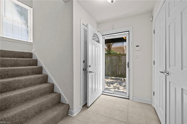 208 56th St Unit B, Virginia Beach, VA 23451 - foyer entrance with stairs, light tile patterned floors, and baseboards