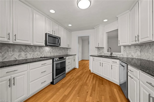 208 56th St Unit B, Virginia Beach, VA 23451 - kitchen featuring stainless steel appliances, a sink, white cabinets, recessed lighting, and light wood-type flooring