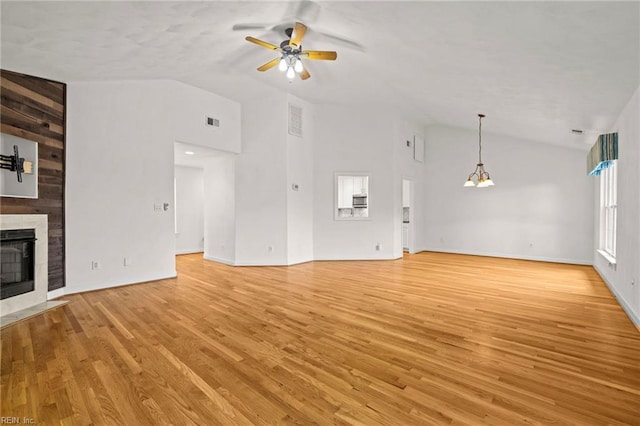 208 56th St Unit B, Virginia Beach, VA 23451 - unfurnished living room with vaulted ceiling, a ceiling fan, a fireplace with flush hearth, light wood-style floors, and baseboards