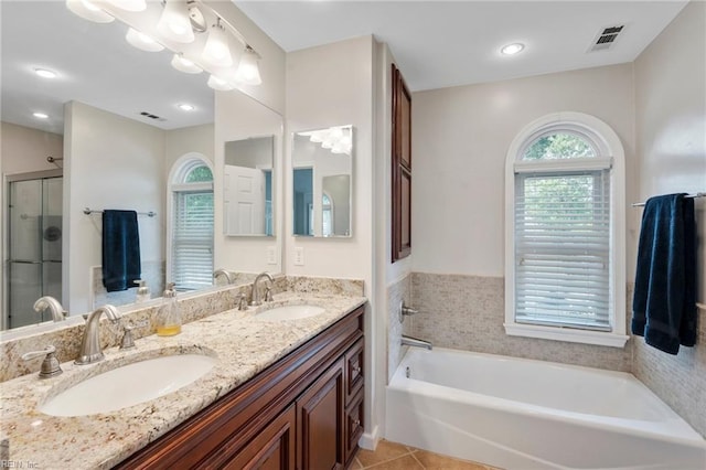 4712 Condor Dr, Chesapeake, VA 23321 - bathroom featuring a garden tub, tile patterned flooring, double vanity, a shower stall, and recessed lighting