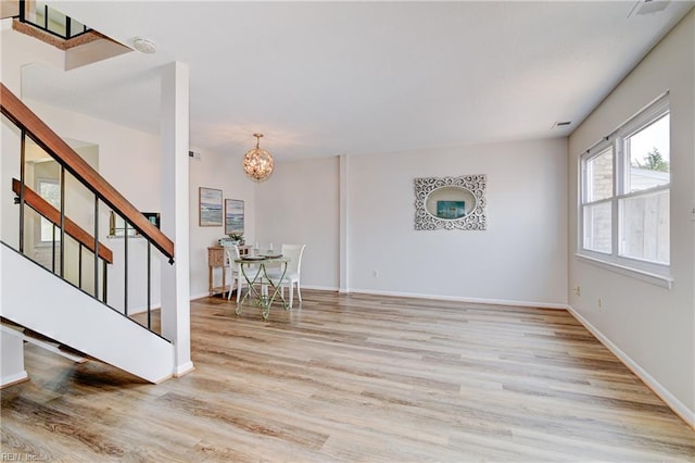 785 Biltmore Dr, Virginia Beach, VA 23454 - living room with stairs, wood finished floors, a chandelier, and baseboards