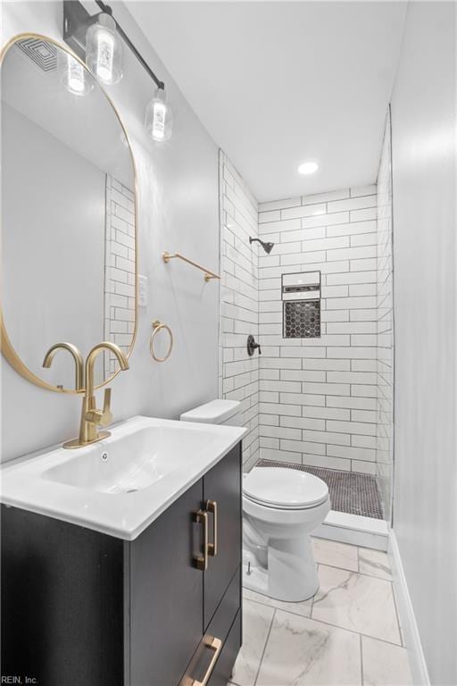 313 Delk St, Franklin, VA 23851 - full bath featuring marble finish flooring, vanity, a shower stall, toilet, and baseboards