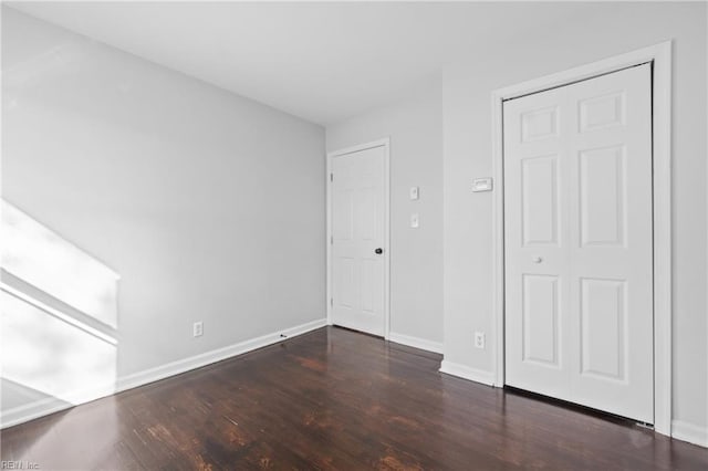 313 Delk St, Franklin, VA 23851 - unfurnished bedroom with wood finished floors and baseboards