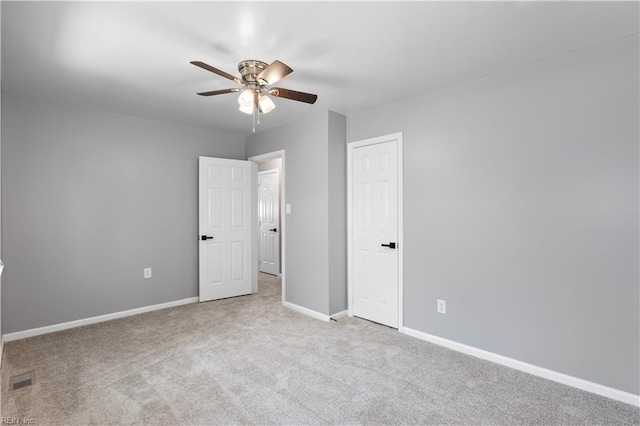 304 Odd Rd, Poquoson, VA 23662 - unfurnished bedroom featuring carpet floors, baseboards, and ceiling fan
