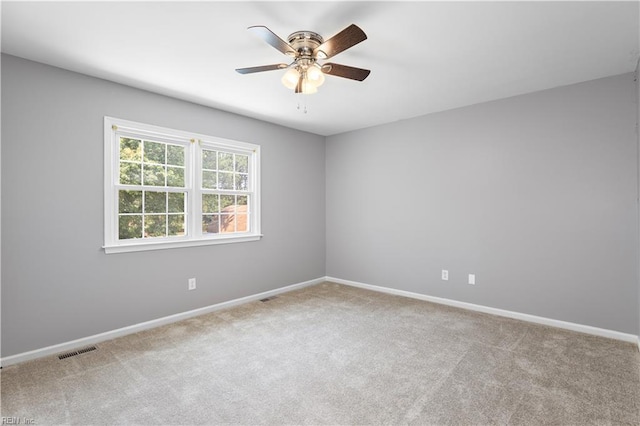 304 Odd Rd, Poquoson, VA 23662 - empty room featuring carpet, ceiling fan, and baseboards