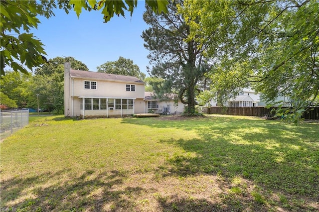 304 Odd Rd, Poquoson, VA 23662 - view of yard with a sunroom