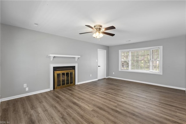 304 Odd Rd, Poquoson, VA 23662 - unfurnished living room with ceiling fan, a glass covered fireplace, wood finished floors, and baseboards
