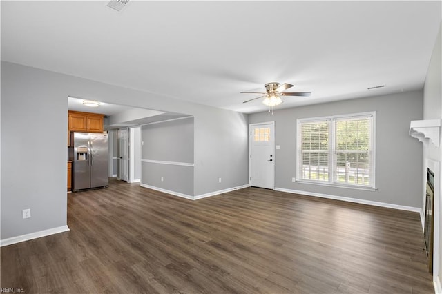 304 Odd Rd, Poquoson, VA 23662 - unfurnished living room featuring a ceiling fan, dark wood-type flooring, baseboards, and a fireplace