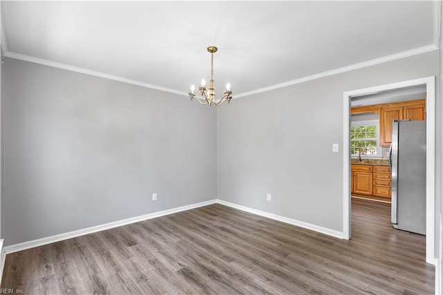 304 Odd Rd, Poquoson, VA 23662 - empty room featuring dark wood-type flooring, a chandelier, crown molding, and baseboards