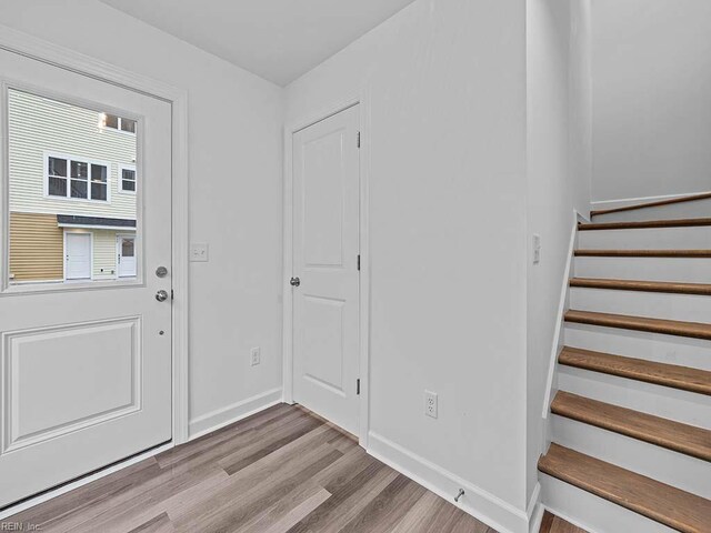 921 Baltic Ave, Virginia Beach, VA 23451 - entryway with wood finished floors, baseboards, and stairs